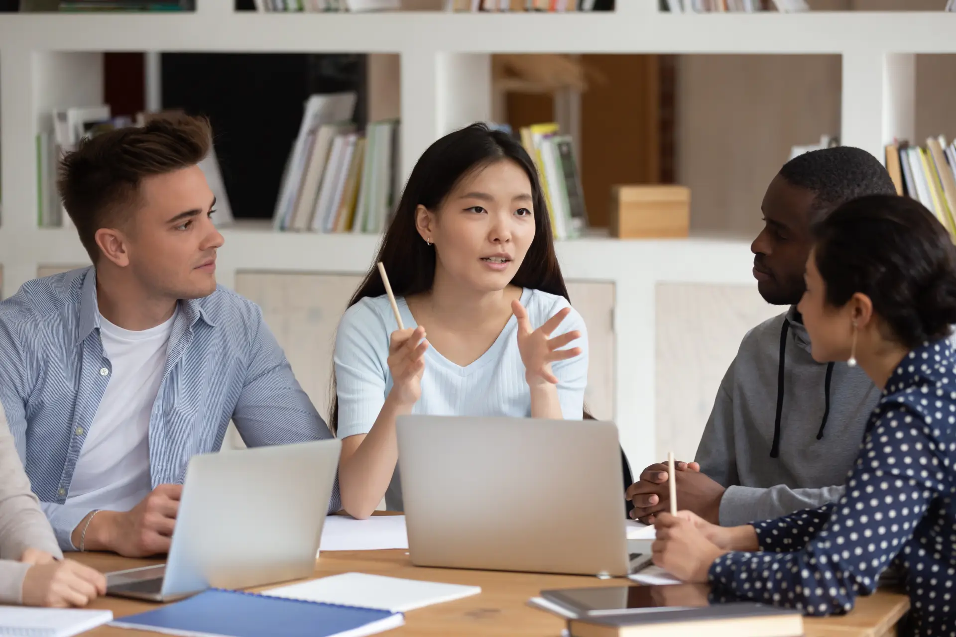 girl explain 3 month sales plan presentation to colleague