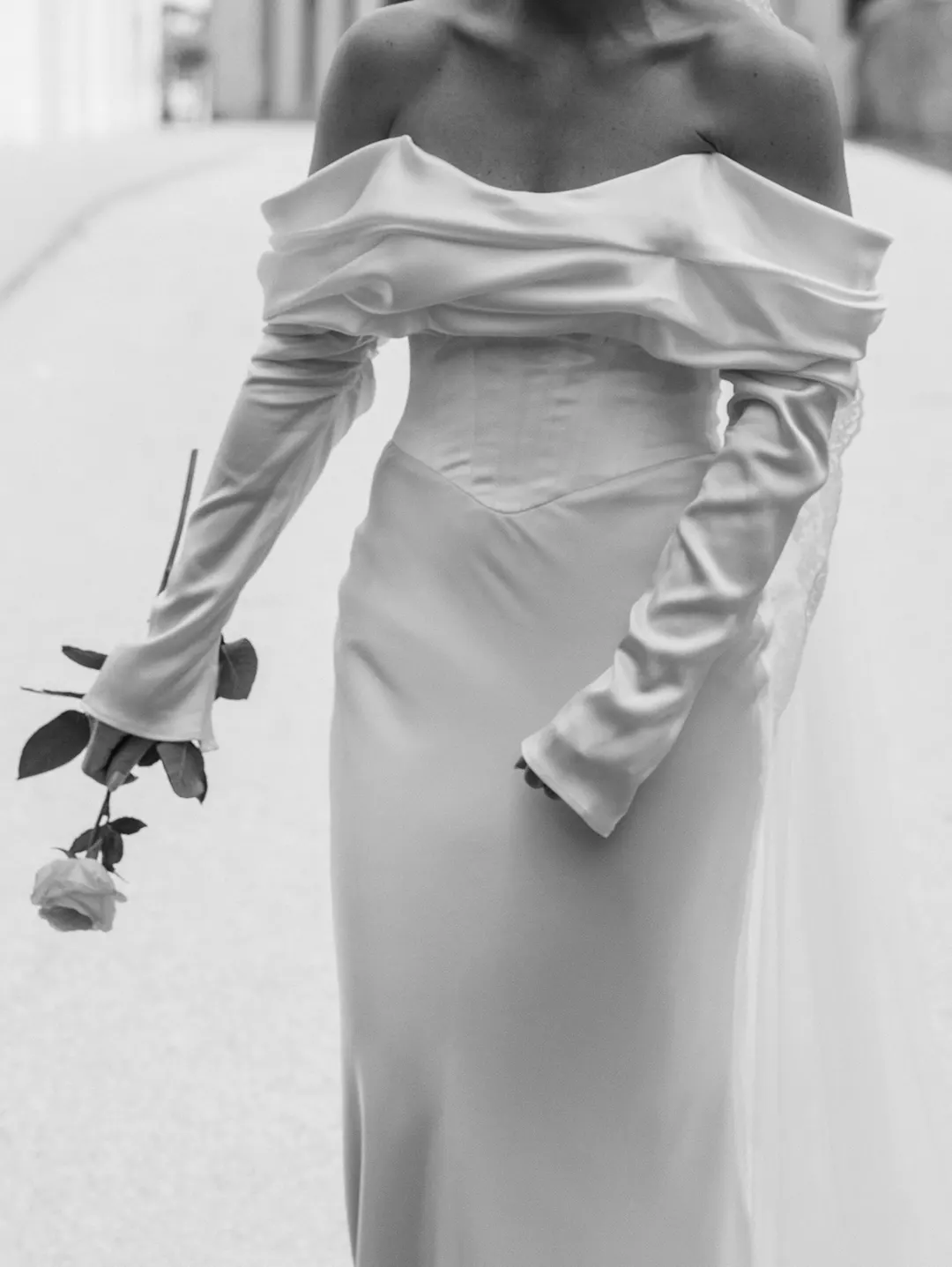 model wearing a pink organsa kim marcel wedding dress