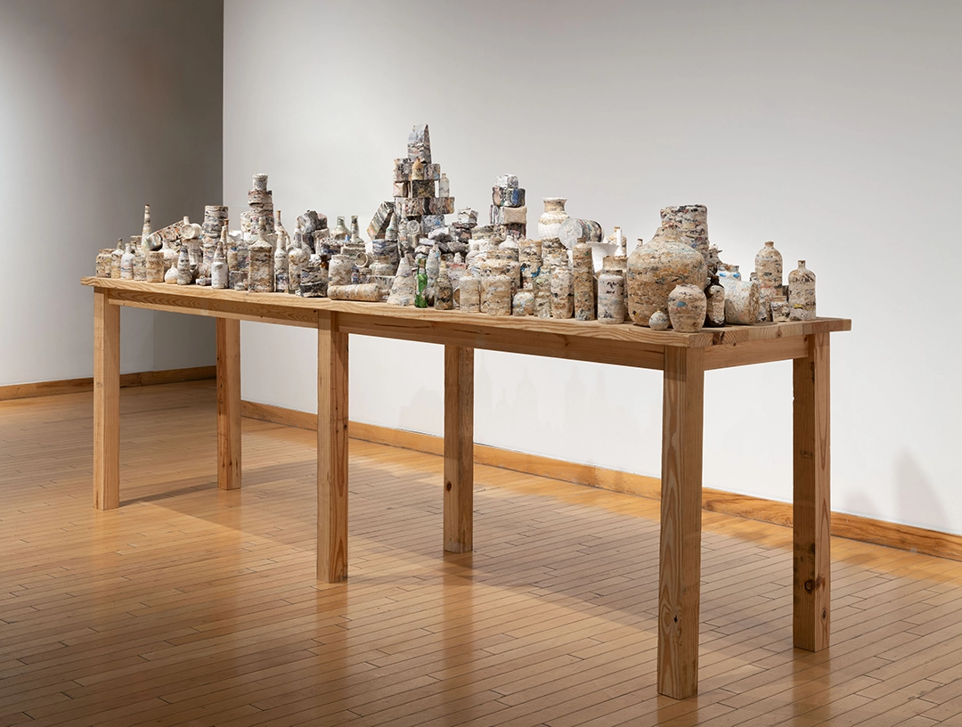 Bacchanalia, 2022, Compressed printed papers | 60 x 144 x 36 in