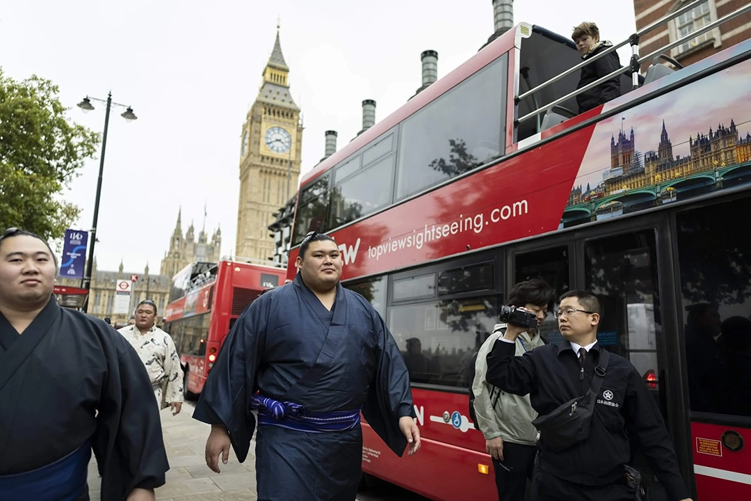 Onosato, one of the sport’s biggest stars, walks near the Houses of Parliament during a tour of London. Photograph: Ryan Pierse/Getty Images