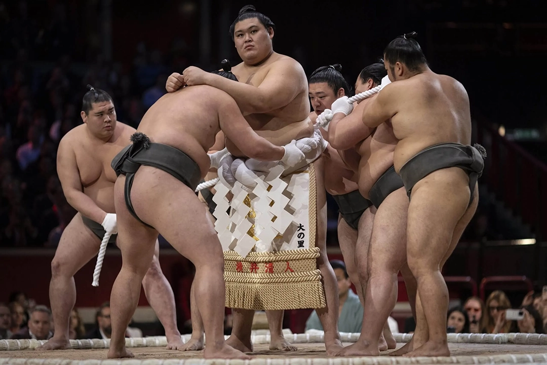 The Yokozuna perform a ritual where they have a braided rope weighing 9kg tied around their waists to symbolise their dignity. Photograph: Ryan Pierse/Getty Images