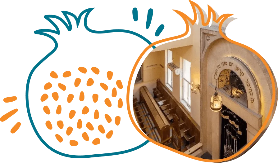Interior view of a synagogue with wooden benches and an ark with Hebrew inscriptions.
