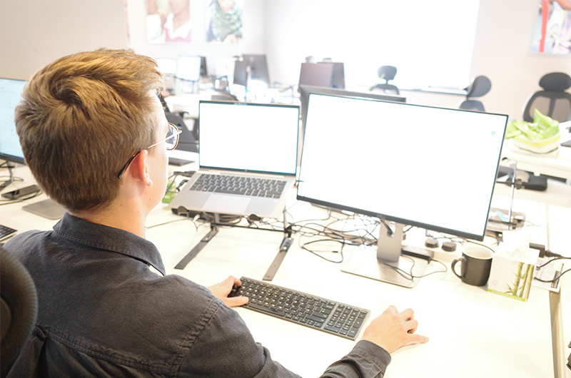 A person looks at a computer screen