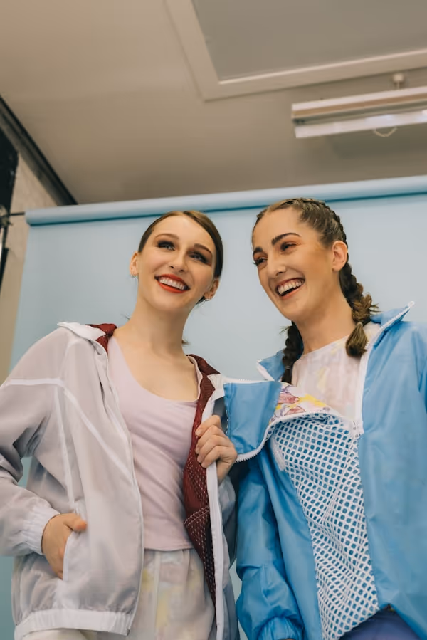 two woman making face