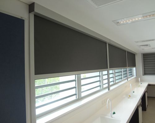 Blockout Roller Blinds with Enclosed Headbox and Side Channels in an Education Setting