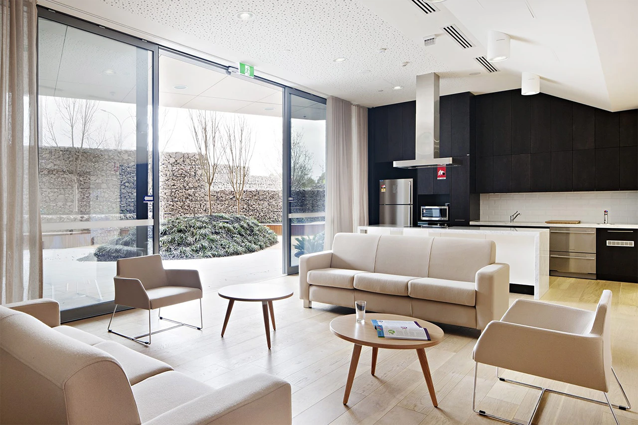 Cancer centre—transparent roller blinds balancing glare control and privacy