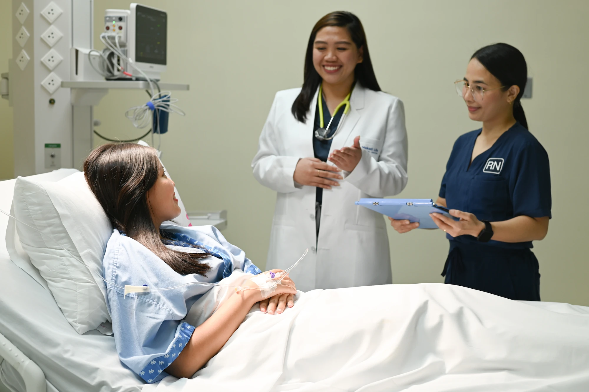 Image of doctor and nurse visiting patient