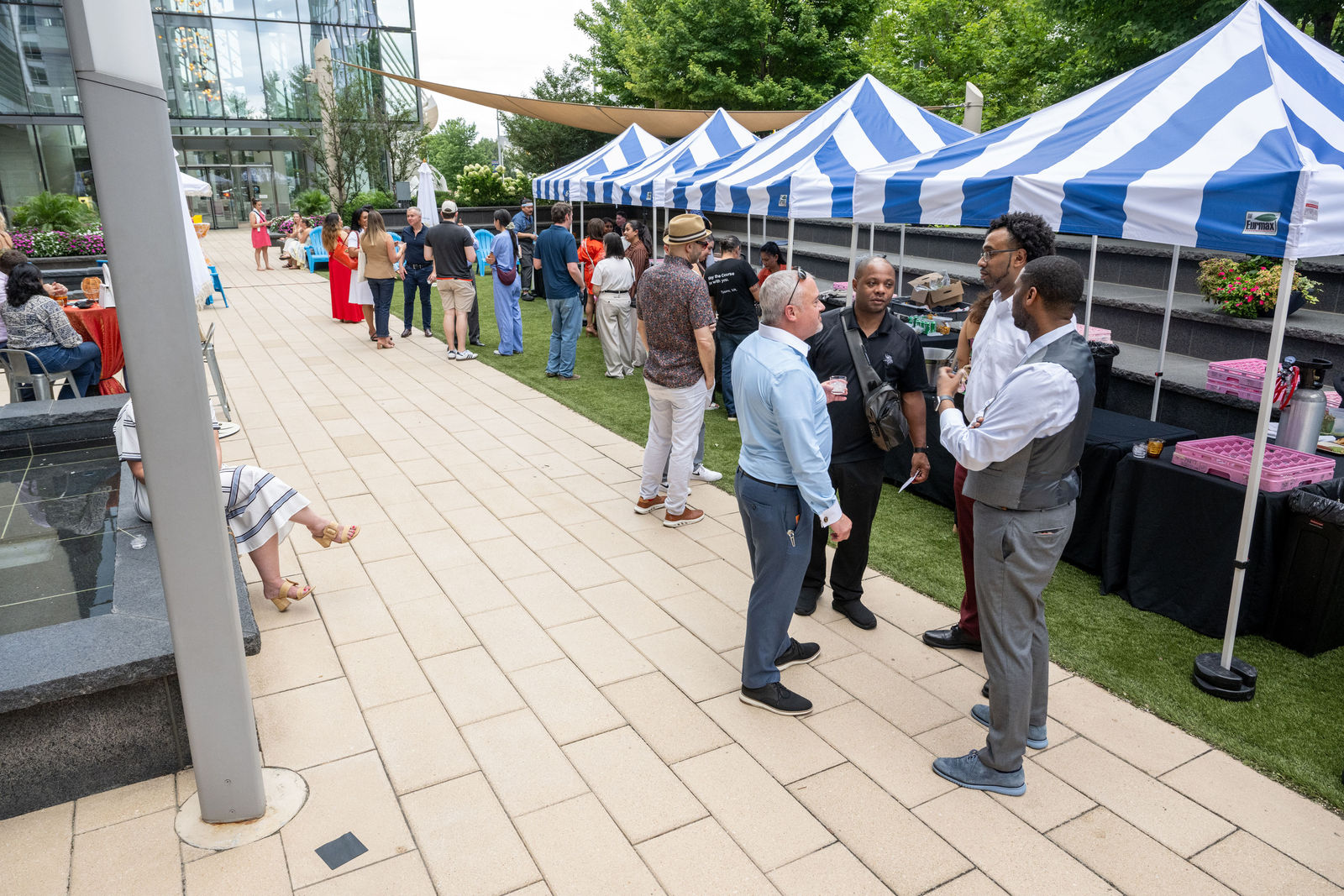 Attendees mingling and browsing tasting booths at the outdoor Culinary Week event at Capital One Center 2026