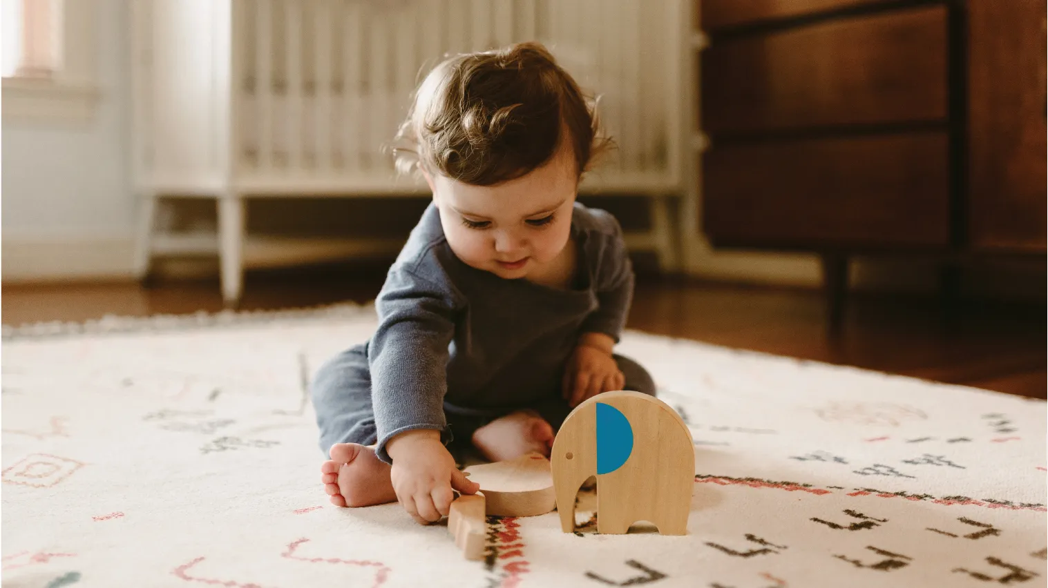child playing with makemade animal wooden toy