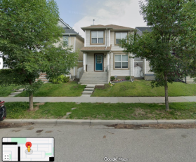 A house with trees and grassAI-generated content may be incorrect.