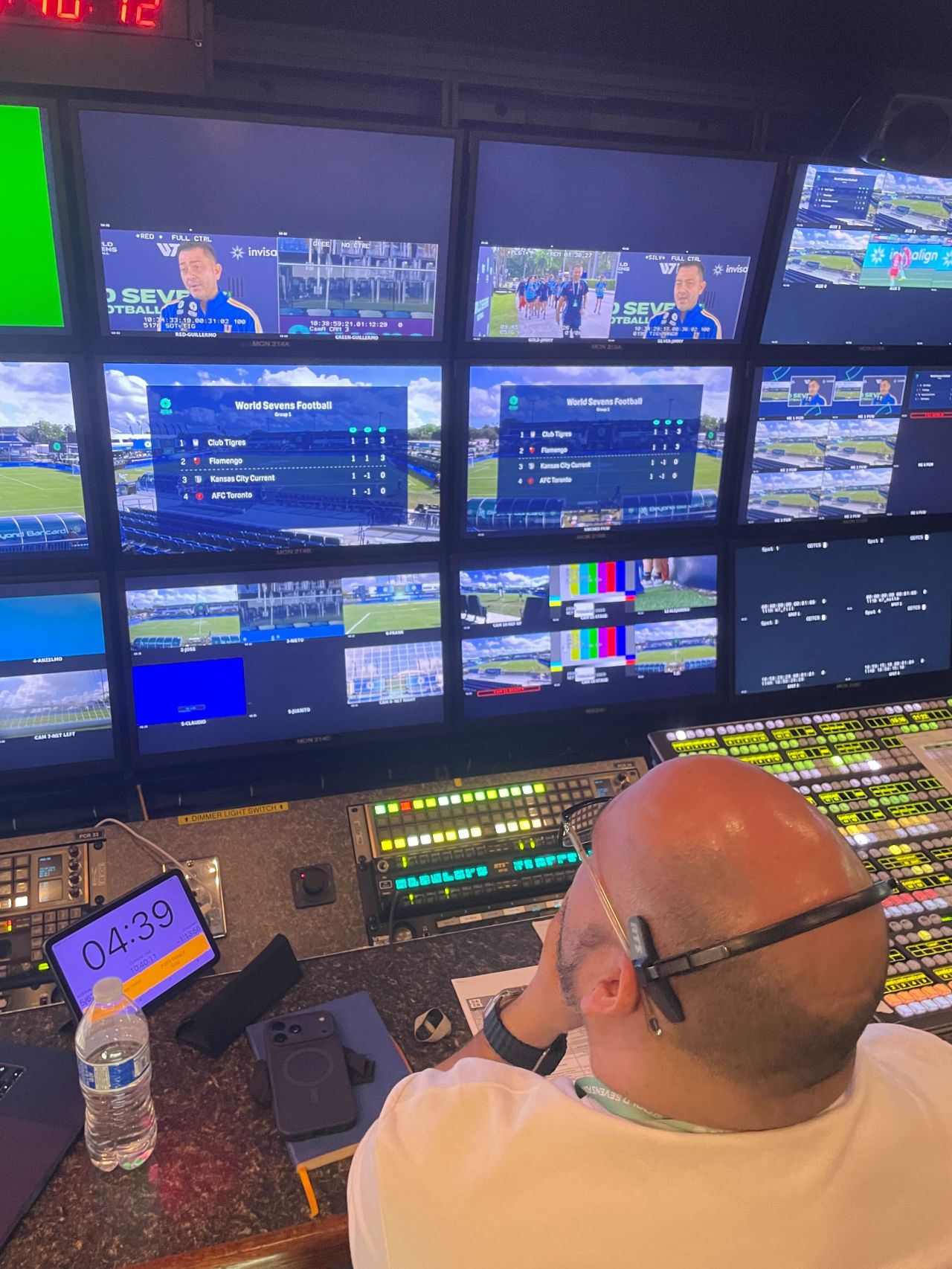 Control room showing World Sevens Football graphics and multiview monitors