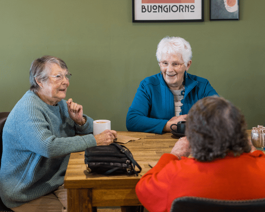 Consumers enjoying conversation at a cafe