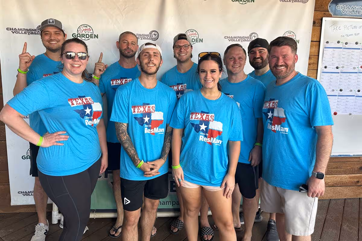 ResMan team on a beach volleyball court