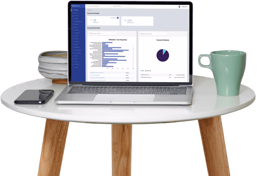 Laptop computer on a small table with a cup of coffee