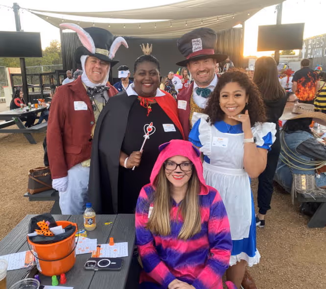 ResMan team members dressed up as characters from Alice in Wonderland