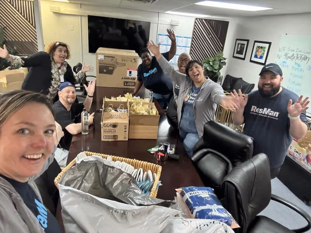 The ResMan team packing boxes