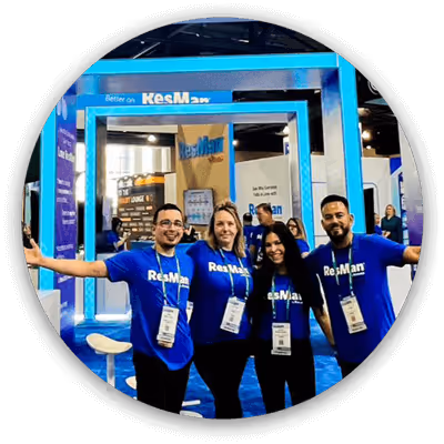 ResMan team members in front of the NAA 2024 booth