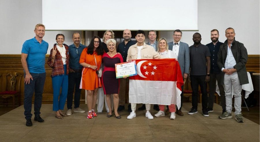 A group of people posing for a photoDescription automatically generated