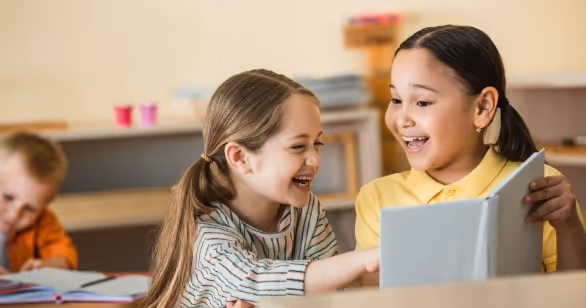 two children making friends at playschool, representing navigating cultural differences in foster care