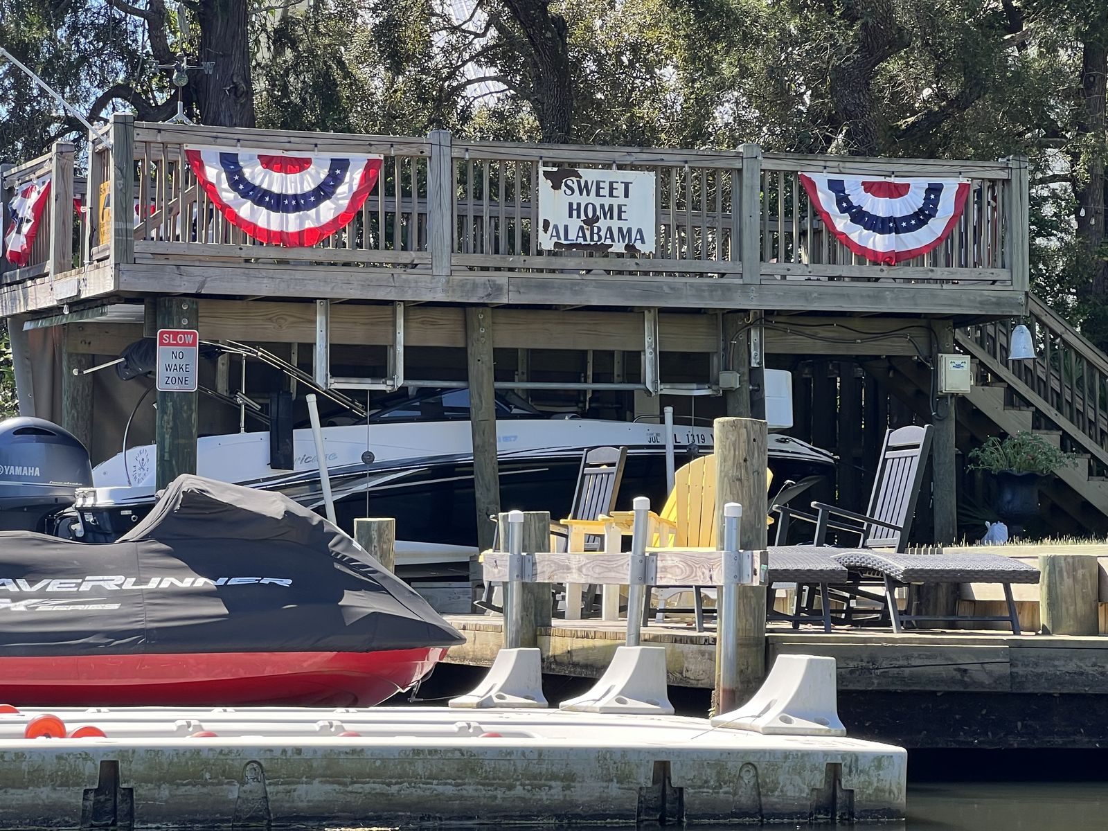 Sweet Home Alabama sign at a waterfront home on Fish River