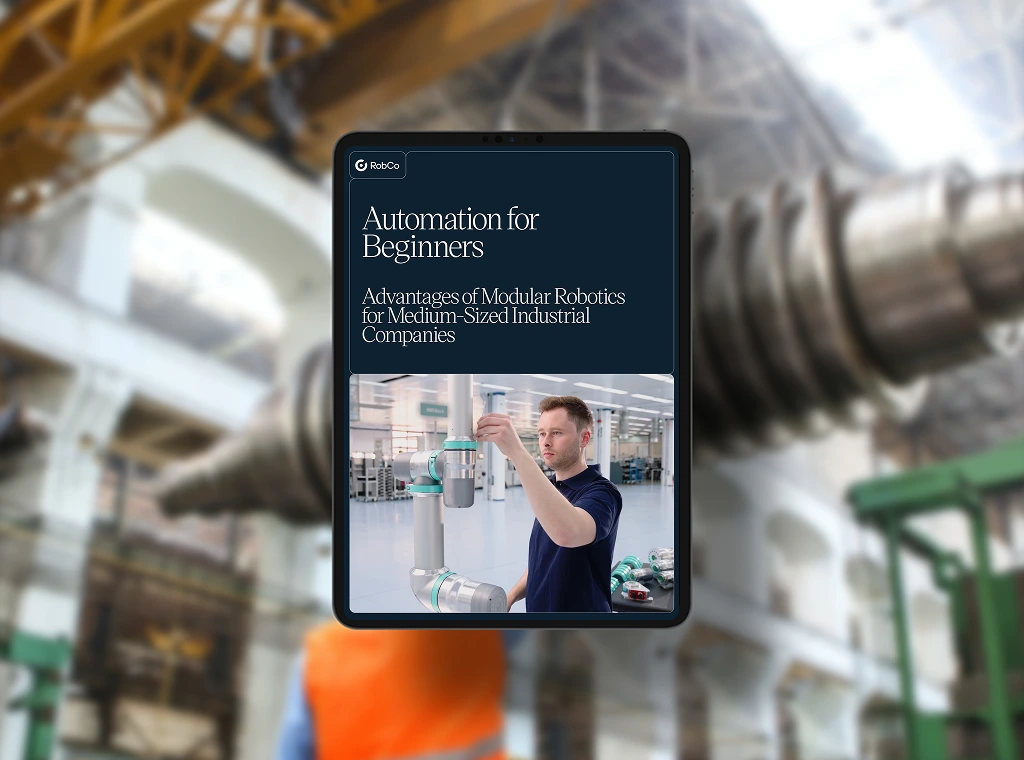 White paper mockup titled "Automation for Beginners”. Background image in an industrial environment.