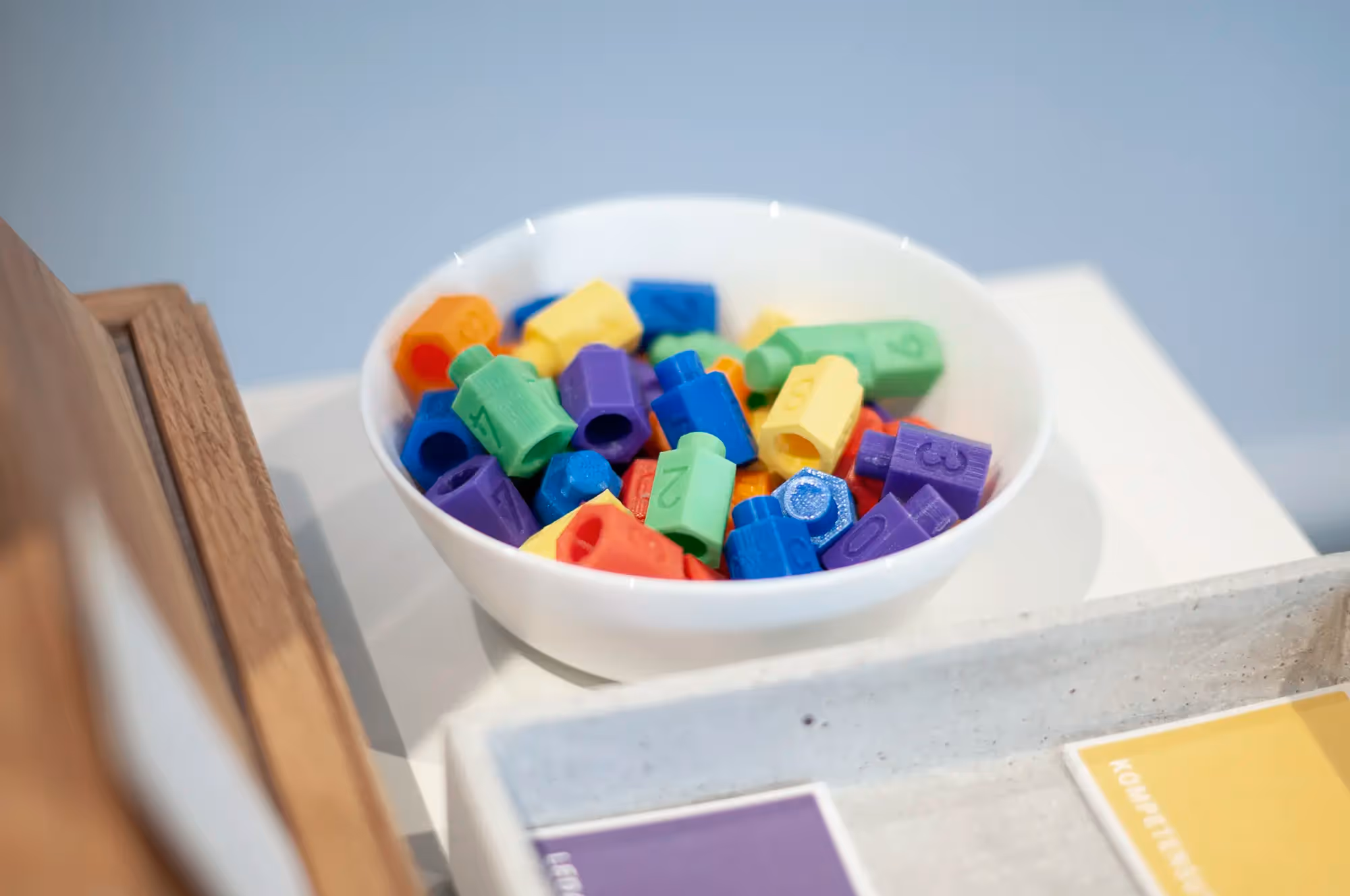 Several pawns in different colors in a bowl