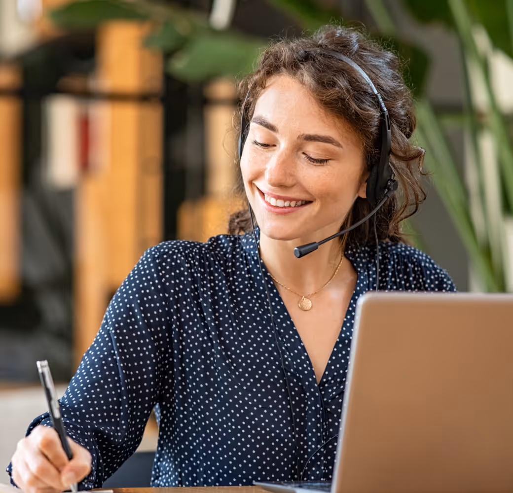 The support representative diligently takes notes while discussing the customer's situation, actively exploring and presenting available options for their consideration.