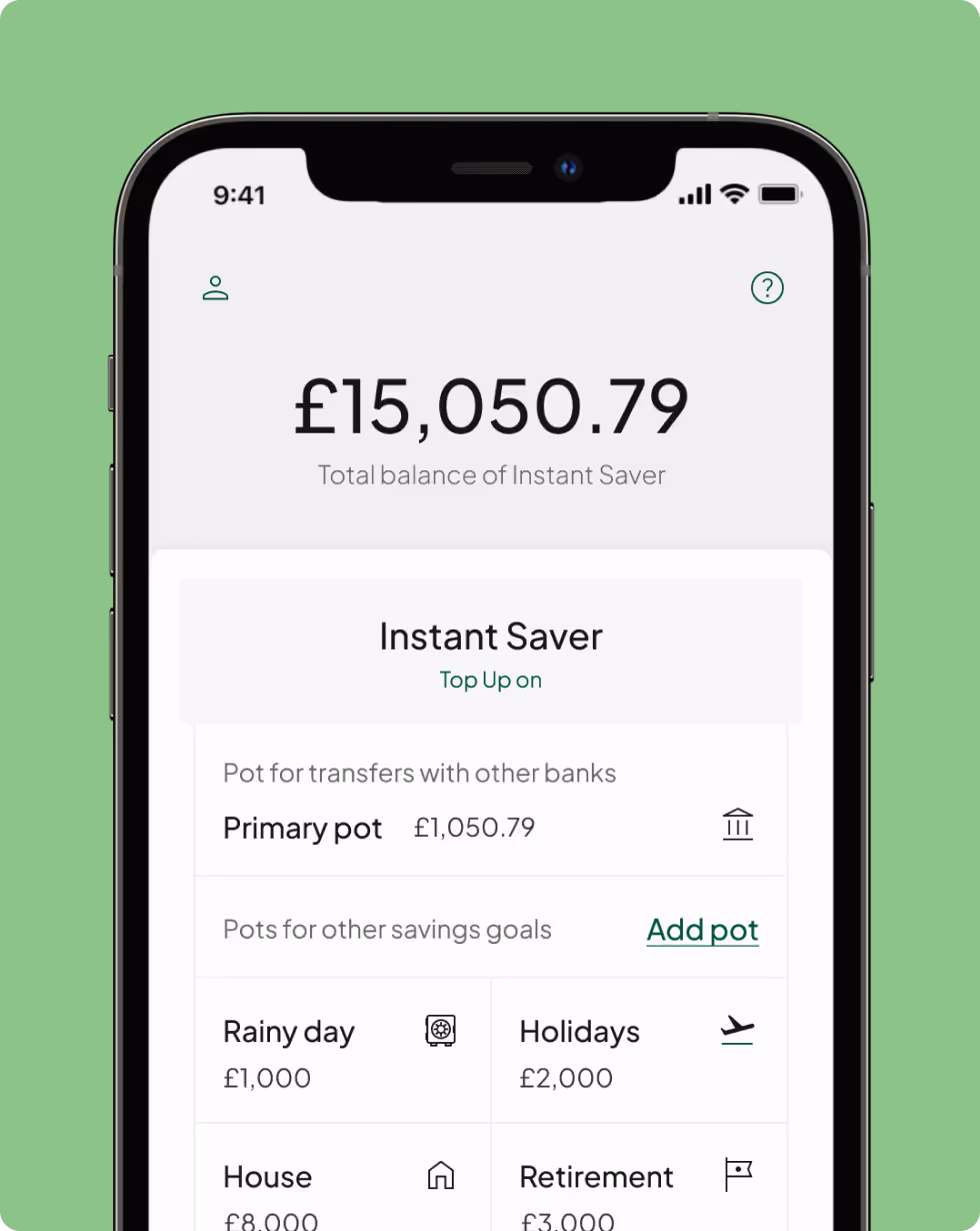 The Tandem App's smart phone screen displays an Instant Access Savings account, simplifying savings towards diverse financial goals.