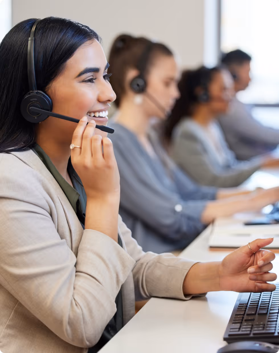 Close-up of a woman's hands holding her smartphone, showcasing the savings securely locked in her Tandem Fixed Saver account displayed on the screen.