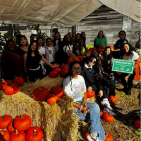 Au pairs taking a group picture at the pumpkin patch