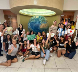 AuPairCare au pairs and staff posing for a picture after celebrating exchange day.