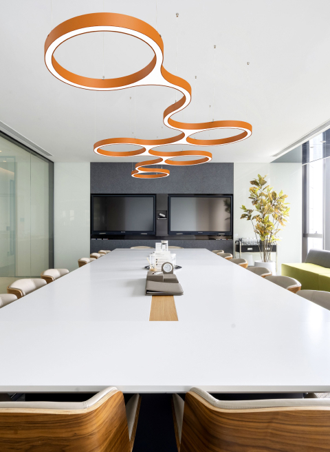 A modern conference room with stunning orange COLORS led centerpiece.