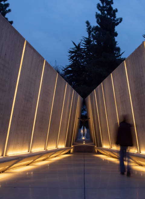 A brutalist architecture out door space with recessed COLORS led lighting.