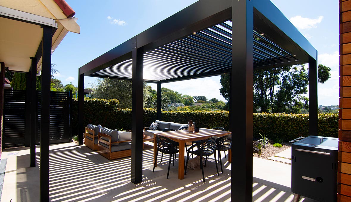 Stylish pergola and outdoor entertainment area in Remuera home