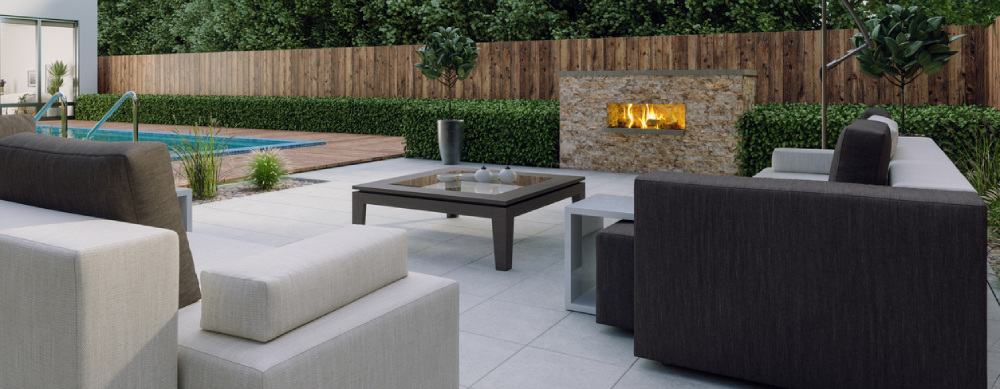 Patio with firepit and poolside lawn area