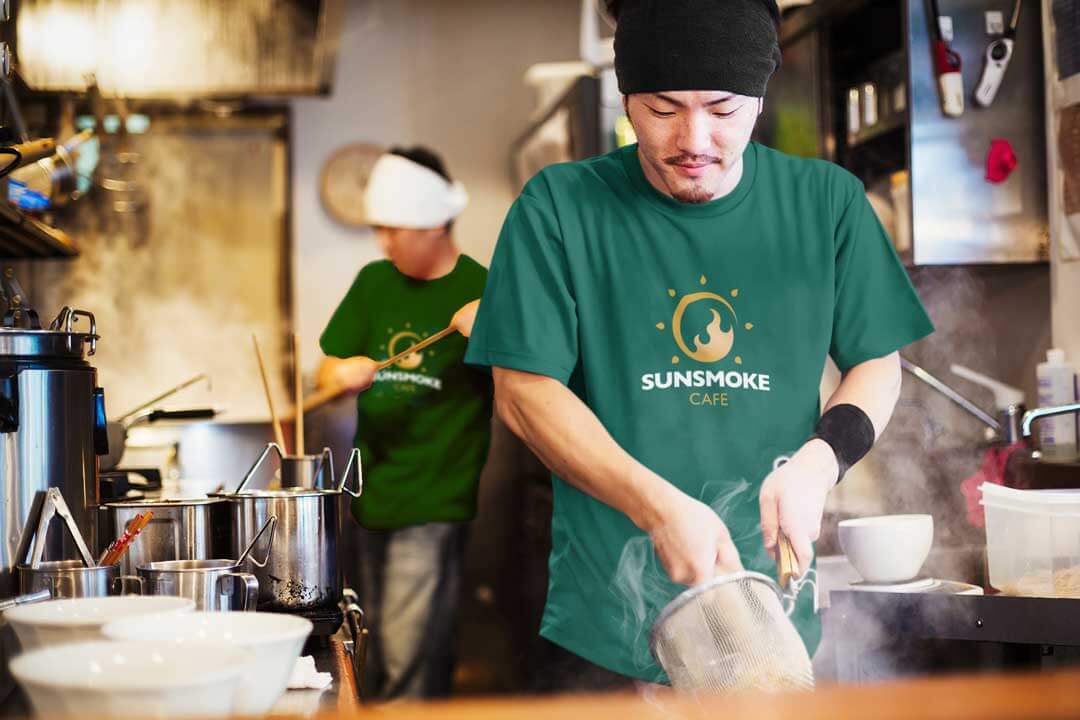 Kitchen staff wearing SunSmoke Cafe tees