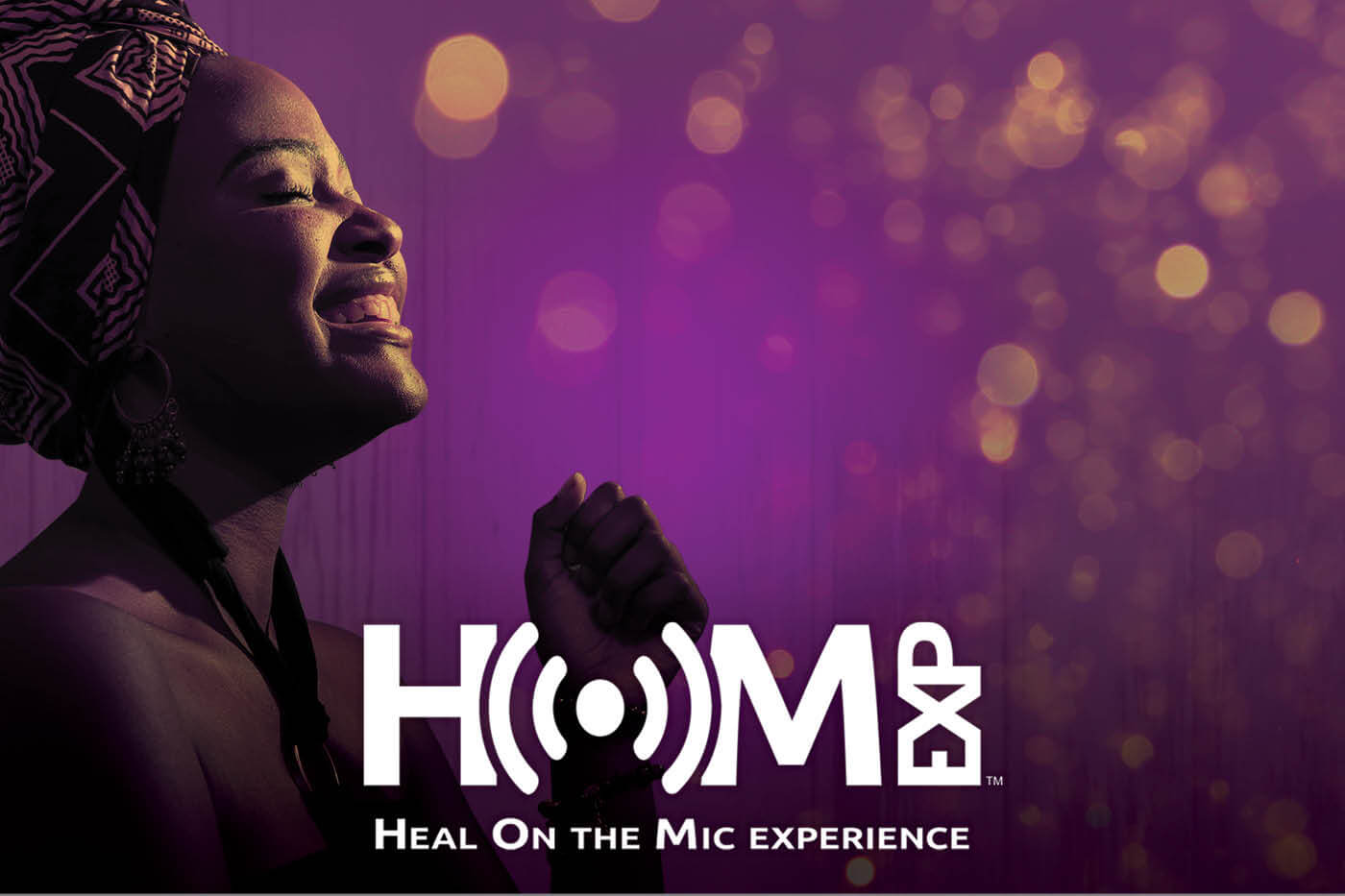 Smiling woman looking upwards with glowing lights floating around. Heal On the Mic experience logo