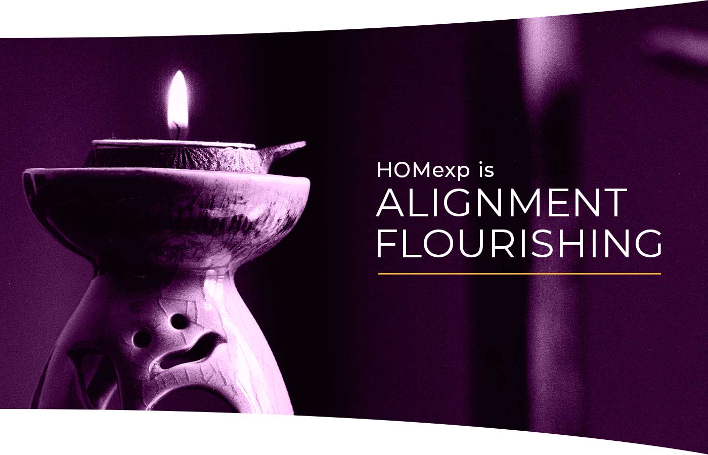 Candle lit with overlaying words "HOMexp is Alignment Flourishing."