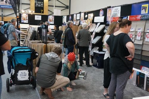 People looking at flooring at the Bay of Plenty Home Show