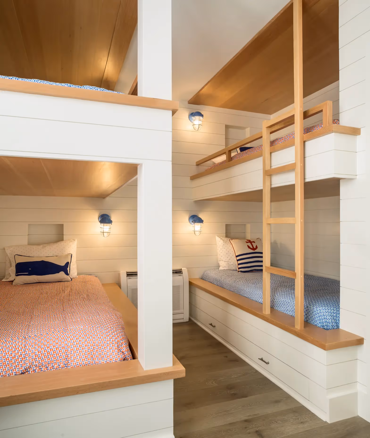 Nautical-themed bunk beds with whale pillow in cozy wooden room