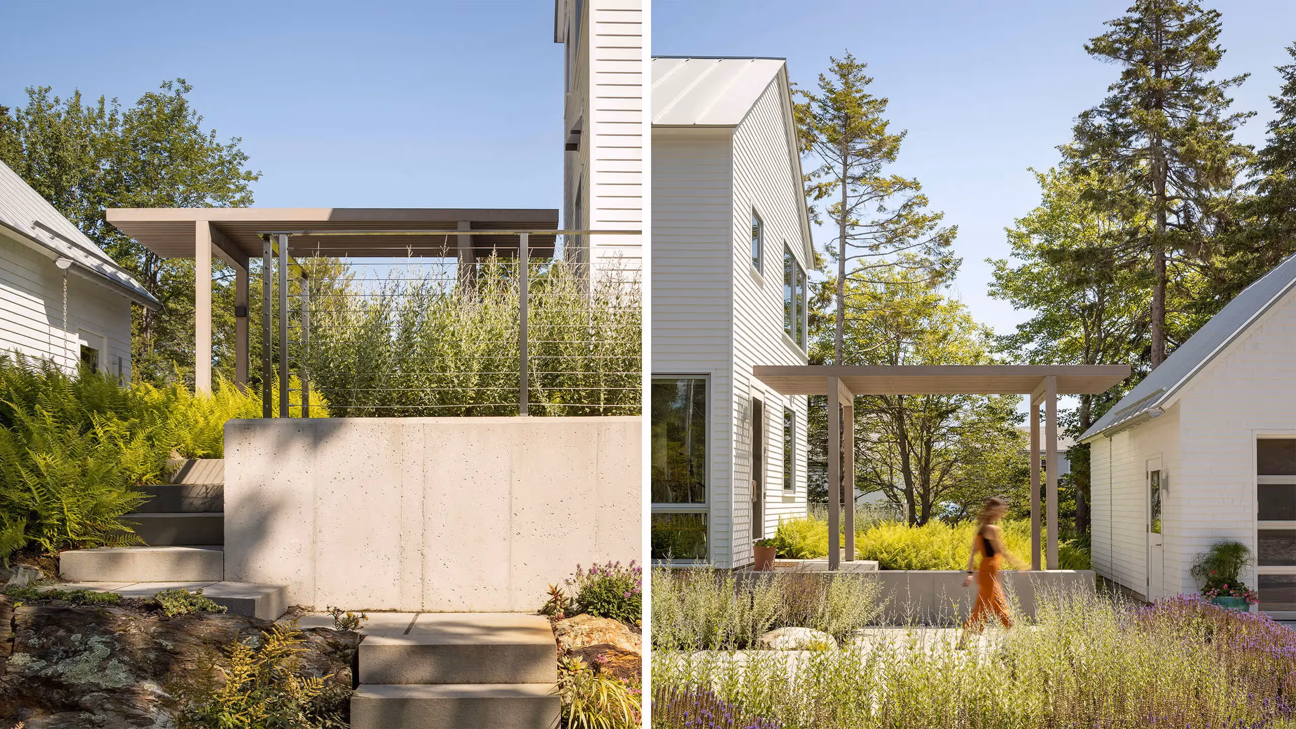 Modern white house with concrete steps and lush landscaped garden