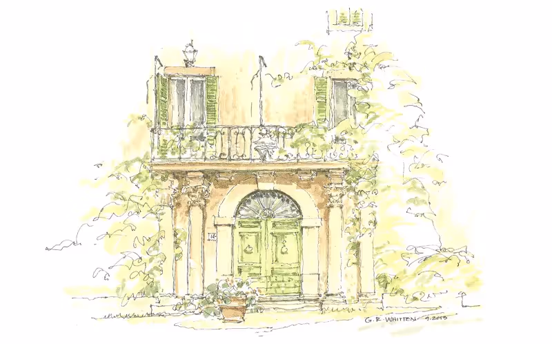 Watercolor sketch of an old European-style building with green shutters and foliage