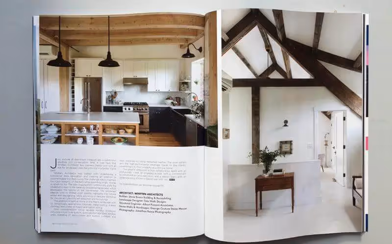 Modern rustic kitchen with wooden beams and pendant lights in open layout