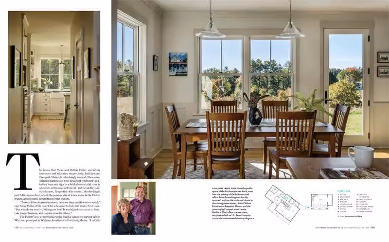 Bright dining room with wooden table, chairs, and large windows overlooking landscape