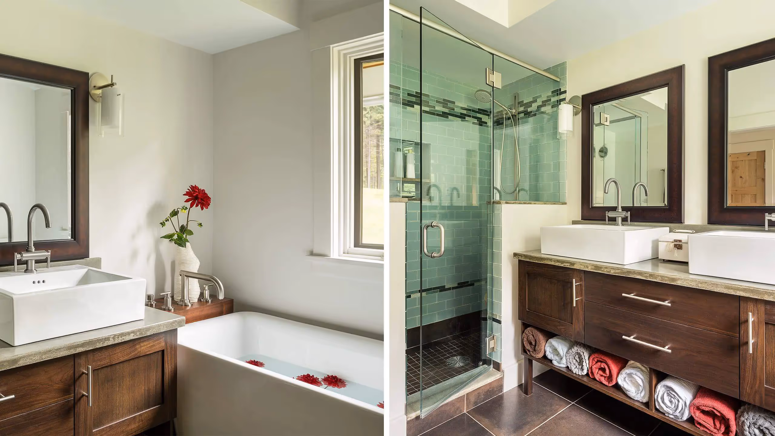 Modern bathroom with green tile shower, wooden vanity, and red flowers