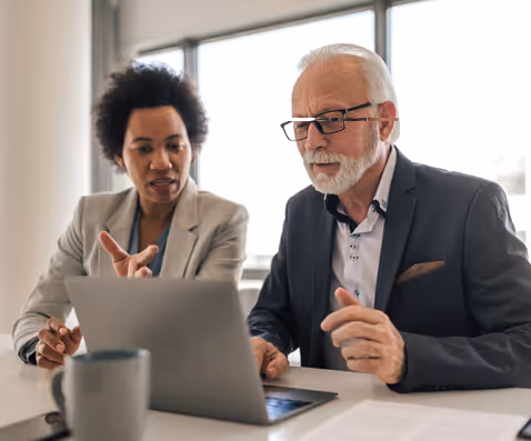 Property management professionals working on laptop