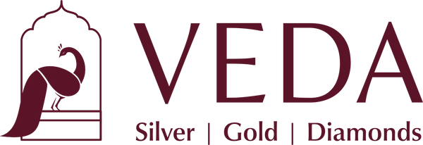 VEDA logo with stylized peacock and text 'Silver | Gold | Diamonds'.