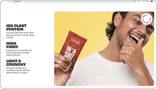 Smiling man holding a red packet of plant protein seed mix against a yellow background.