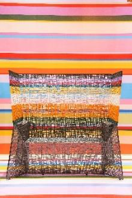 A chair with colorful stripesAI-generated content may be incorrect.