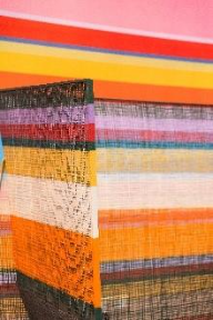 A colorful striped object with a blue backgroundAI-generated content may be incorrect.